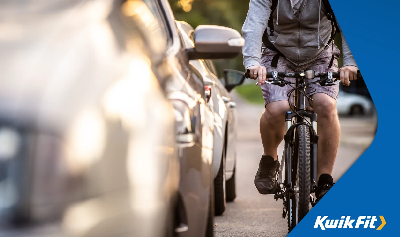 cyclists passing cars