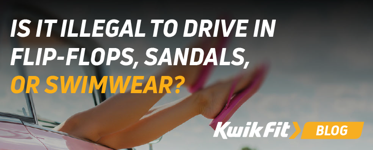 A person inside a car wearing flip flops with their legs out of the window