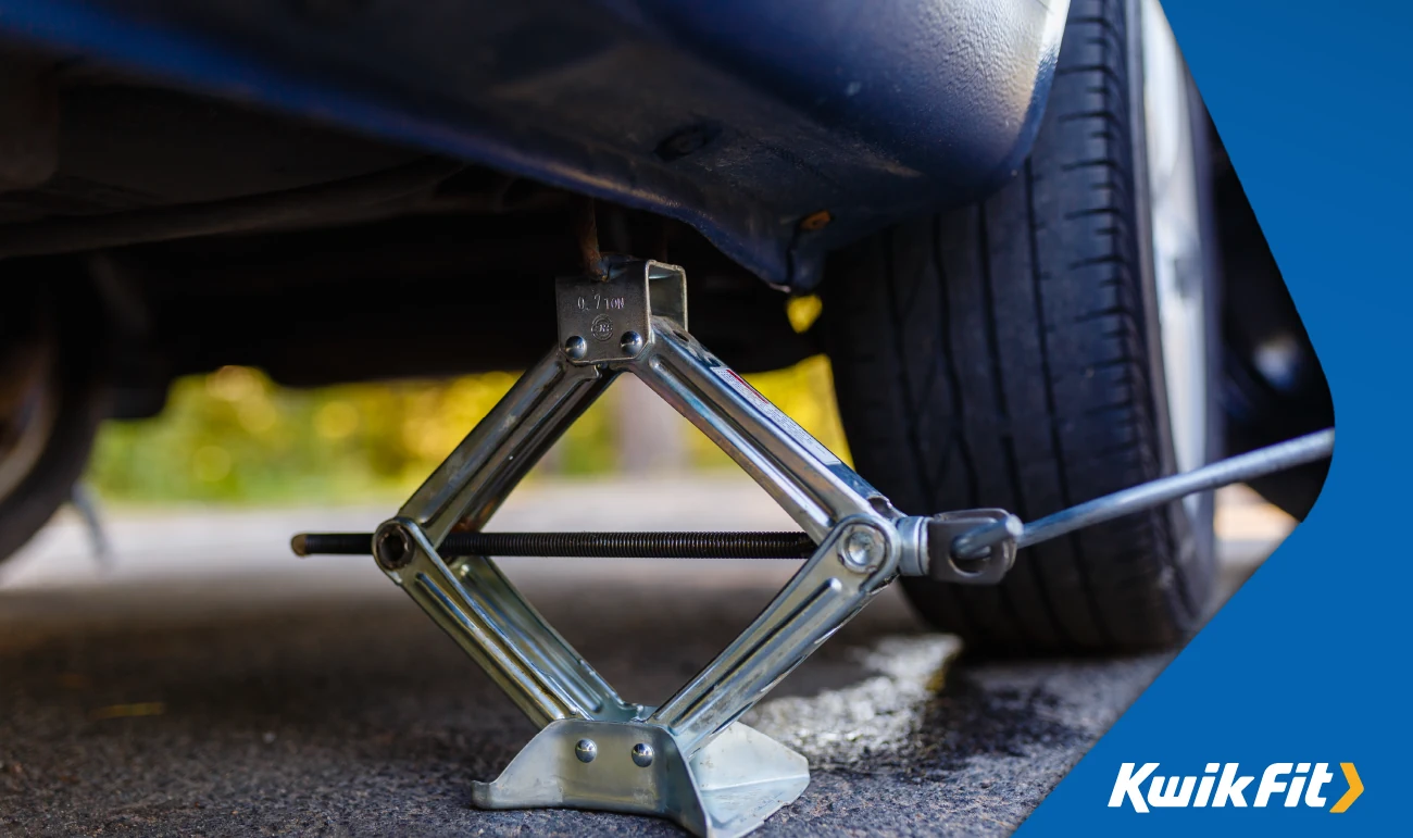 scissor car jack in use