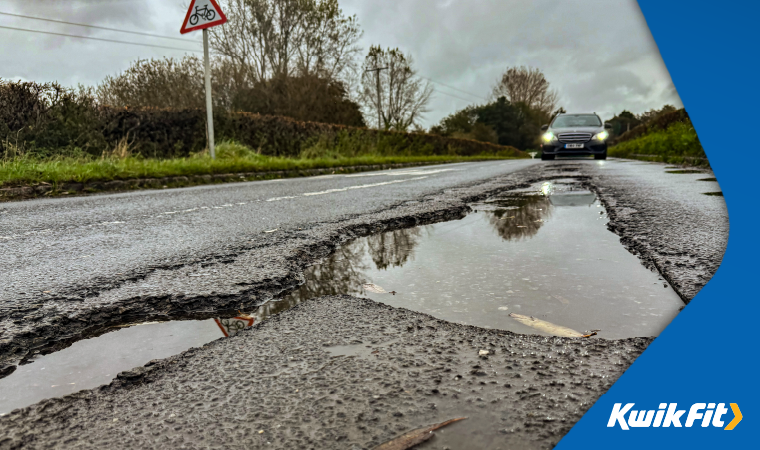 Several large potholes in the road